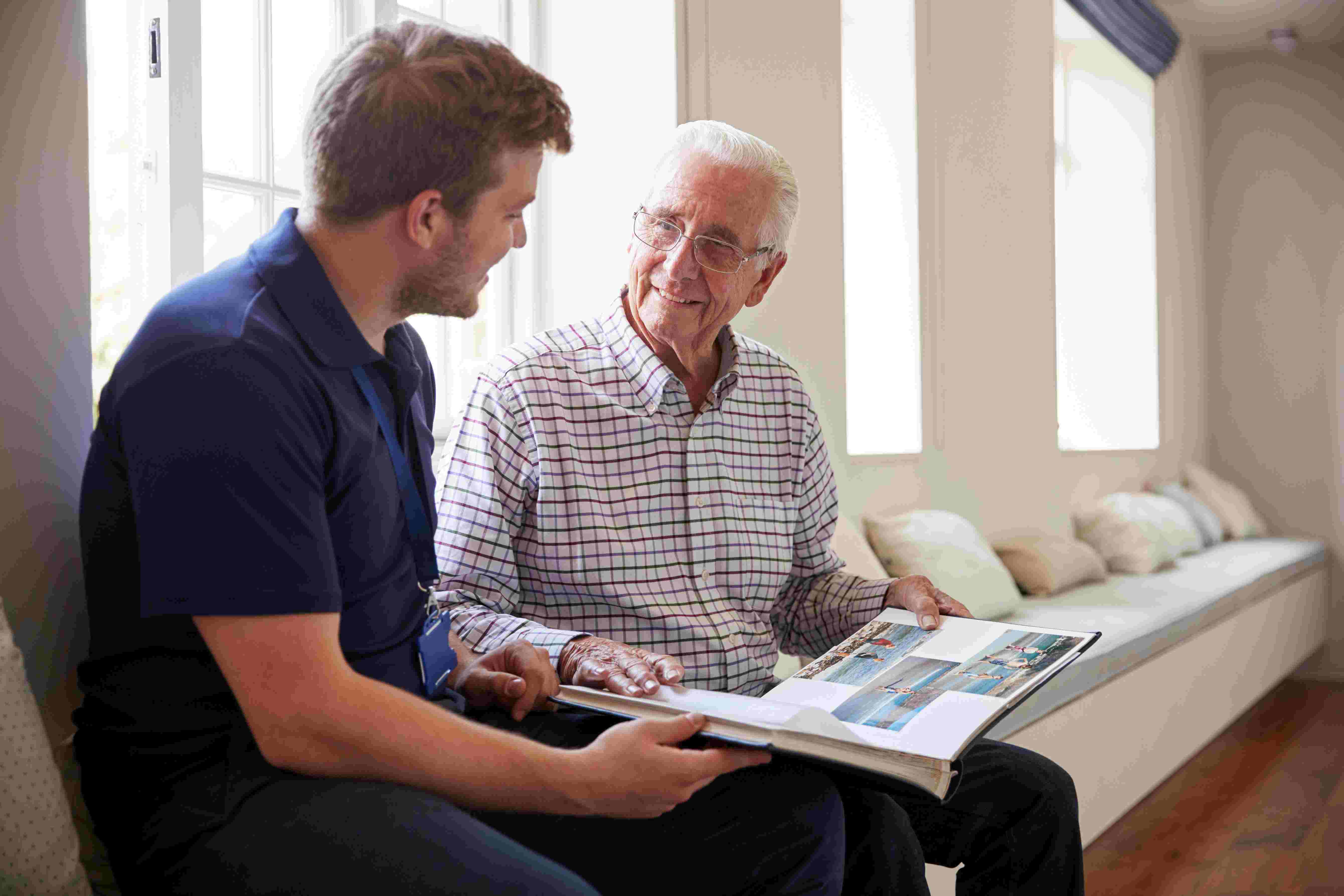 caregiver reading with a man