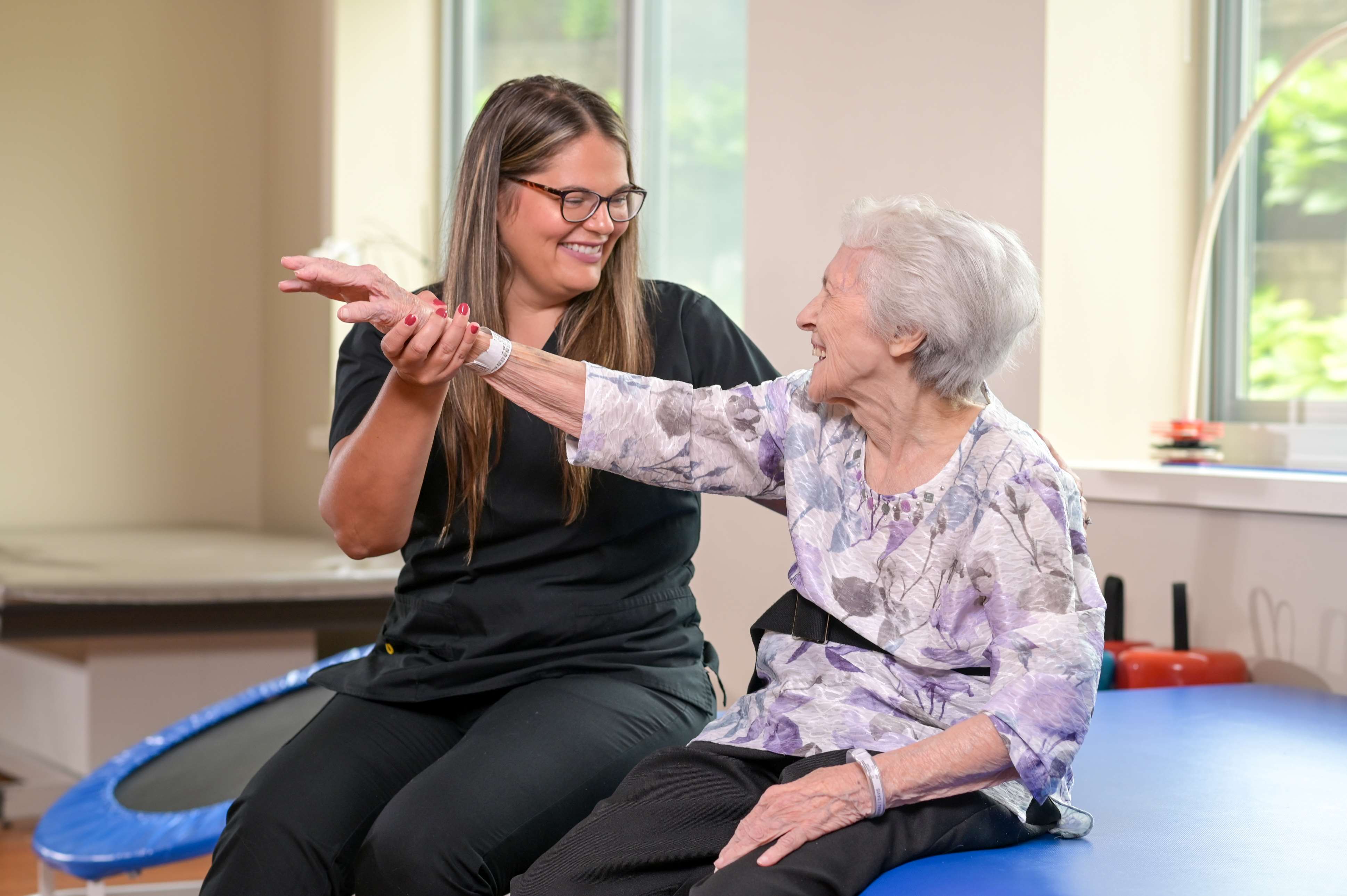 physical therapist with senior female
