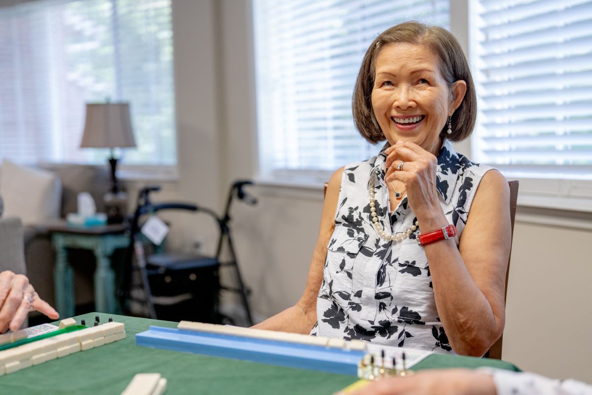 older adult female playing games with group