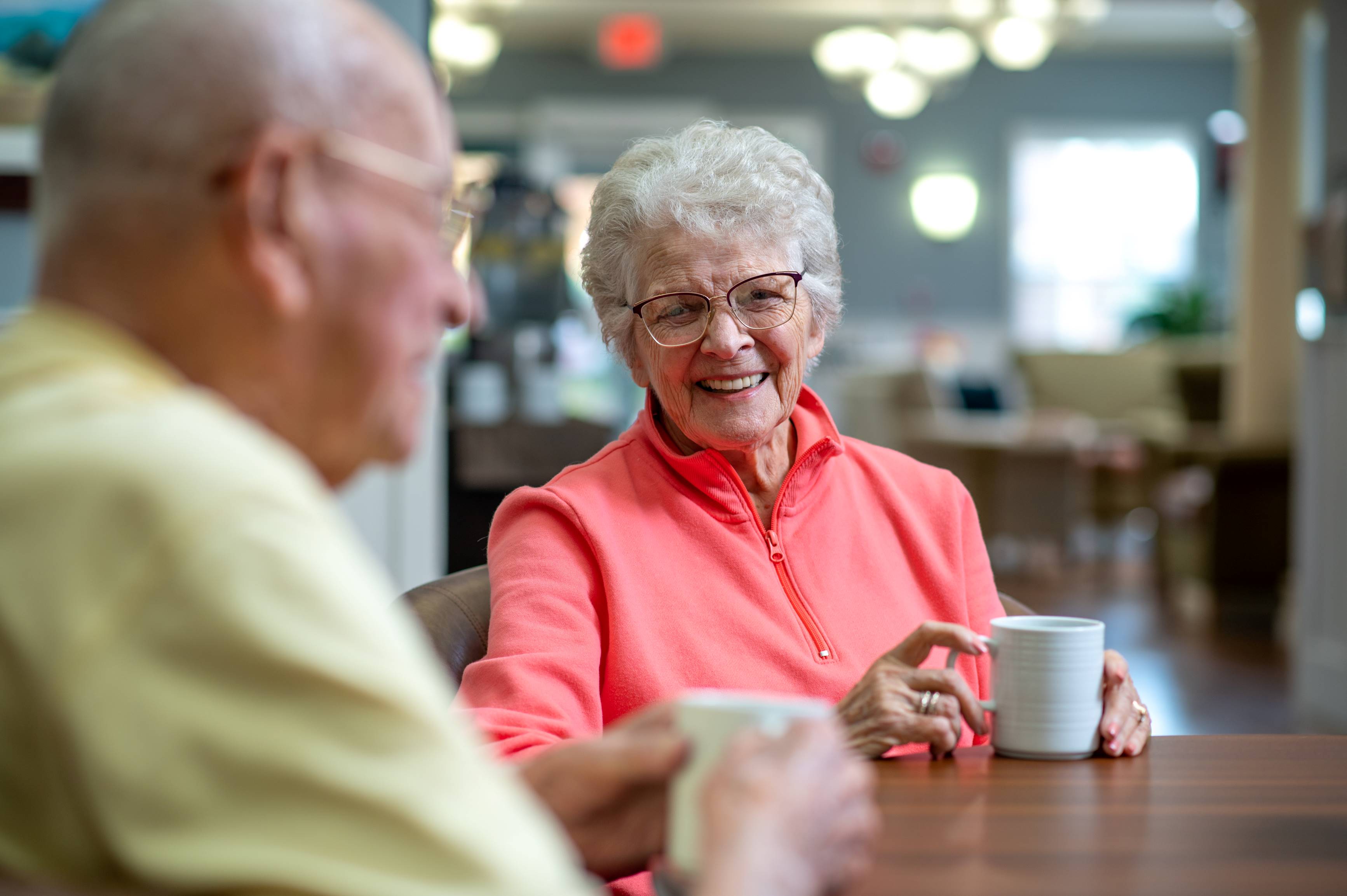 male and female enjoying coffee together