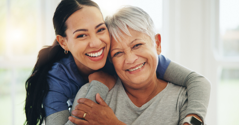 caregivver hugging woman