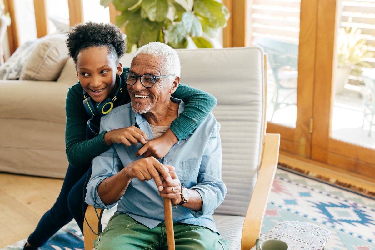 Grandfather in Assisted Living enjoying time with granddaughter