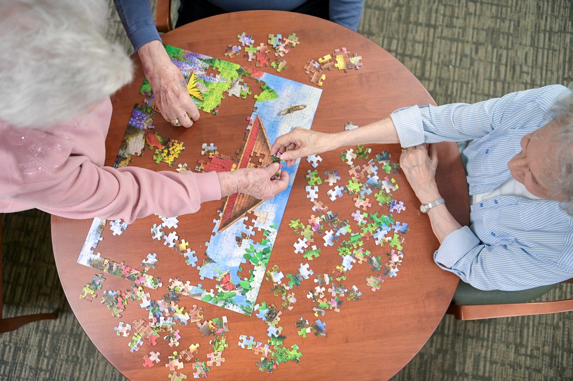 people doing a puzzle