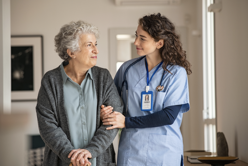 nurse walking with a woman