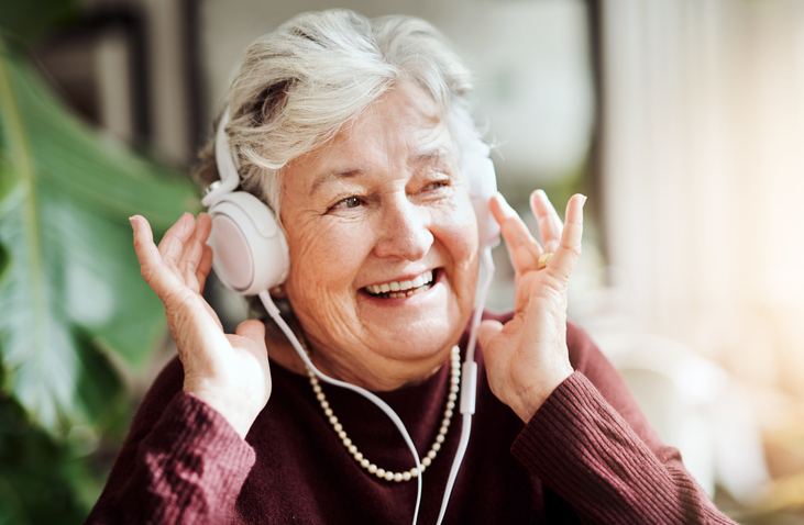 woman with headphone listening to music
